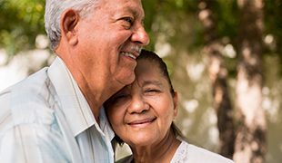 Couple happily standing close to each other Golden Leaves