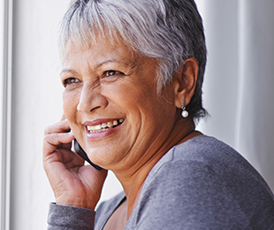 happy senior woman on a phone call