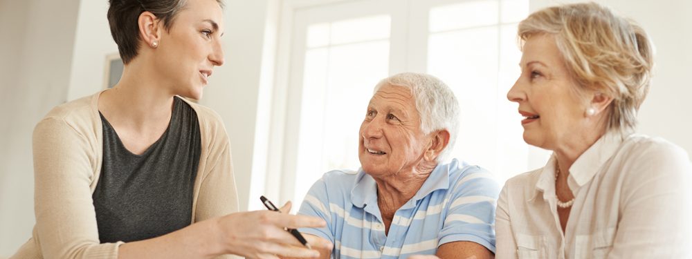 Couple discussing option with a young lady funeral planning advice