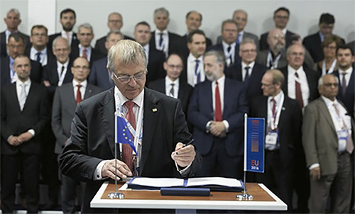 Anorld Pindar Trustee of Golden Leaves, signing european document