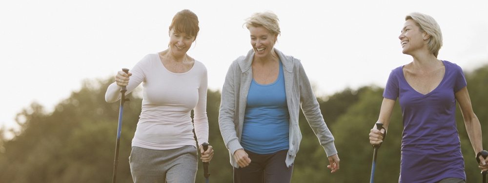 Three ladies walking and chatting