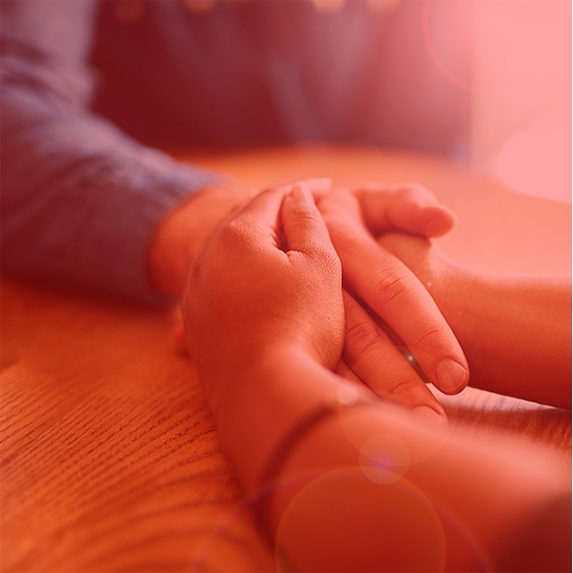 Couple holding hands on a table Golden Leaves