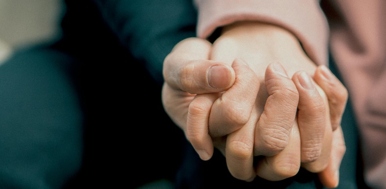 Elderly Couple Holding Hands
