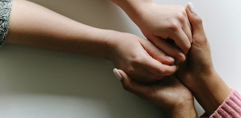 Close Up of Two People Holding Hands