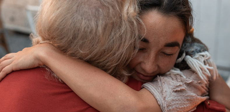 A woman embracing a person