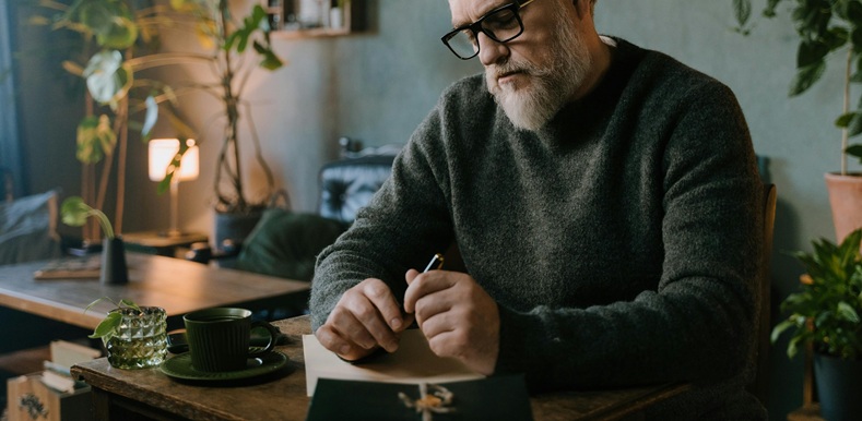 A Man Sitting at the Table