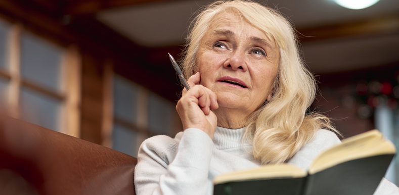 low-angle-elder-woman-holding-agenda